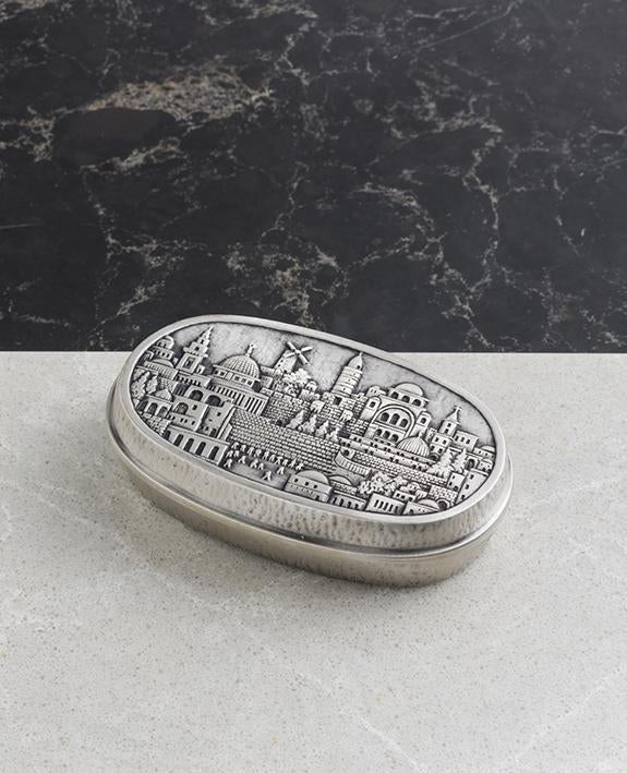 Sterling silver plated candlesticks with Jerusalem embeded on them. Length: 9 cm Width: 6 cm