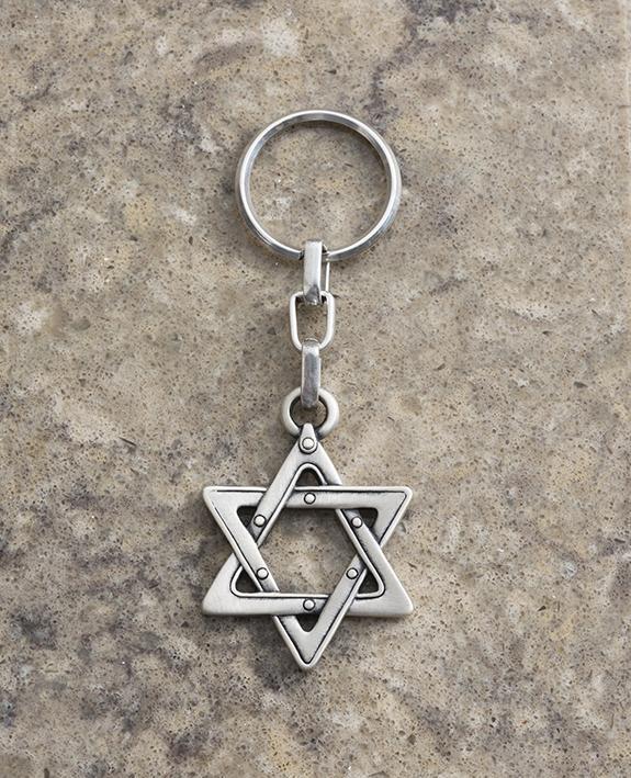 A keychain with a Star of David coated in sterling silver. The gift that says everything. A Star of David that will go everywhere with you to give you the feeling of safety, protection and belonging. Strong, reliable and classically designed, it will always make for a wonderful gift. Length: 5 cm Width: 4 cm