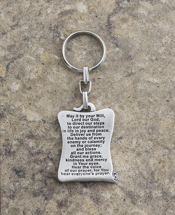 A beautiful keychain designed in the shape of a scroll, on one side the Traveler's Prayer is inscribed in Hebrew and on the other side in English. The keychain is coated in sterling silver, and is strong and reliable to carry your keys. Send your prayer for safe travels permanently, to those close to you that go far away, in Israel and abroad. They will enjoy both sides. Length: 5 cm Width: 4 cm