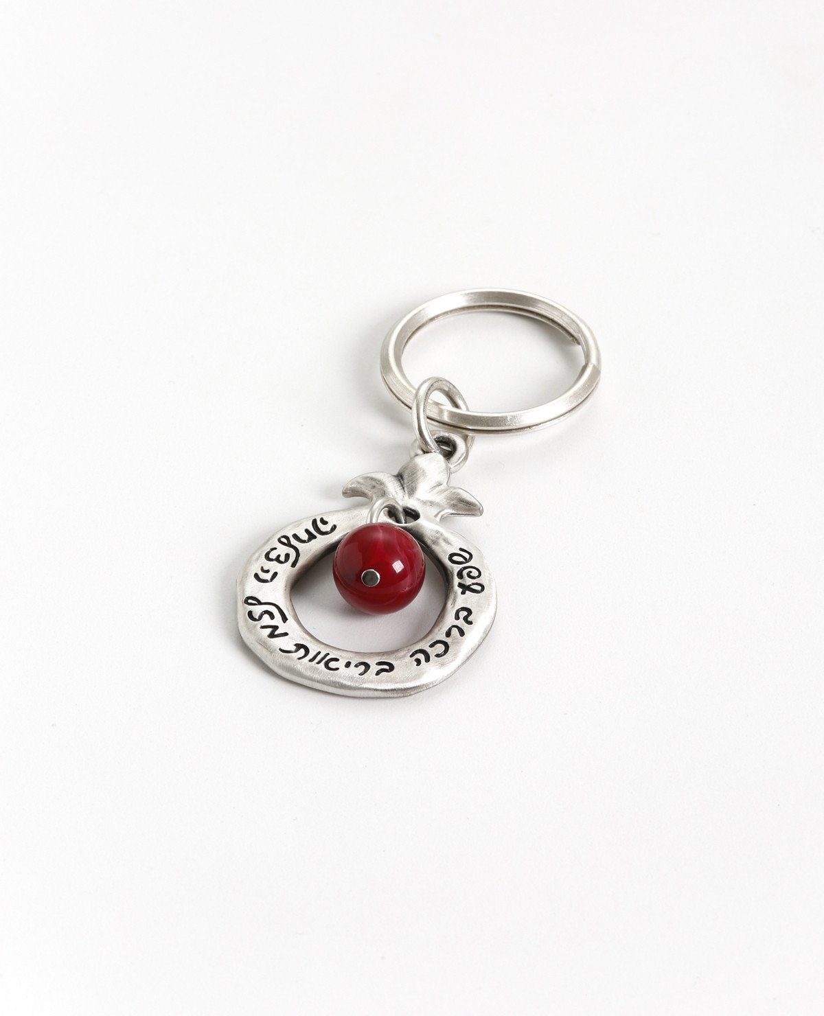 Always bless!
A charming keychain, designed as a hollow pomegranate with a big red bead in the center.
Written on one side are many blessings in Hebrew, and on the other side many blessings in English. The keychain is coated in sterling silver and is strong and reliable.
Makes for quite the useful gift that is also festive and very blessed, suitable for both Hebrew and English speakers, near or far, in Israel and abroad.
Comes also in your choice of turquiose colored bead. Length: 8 cm Width: 4 cm