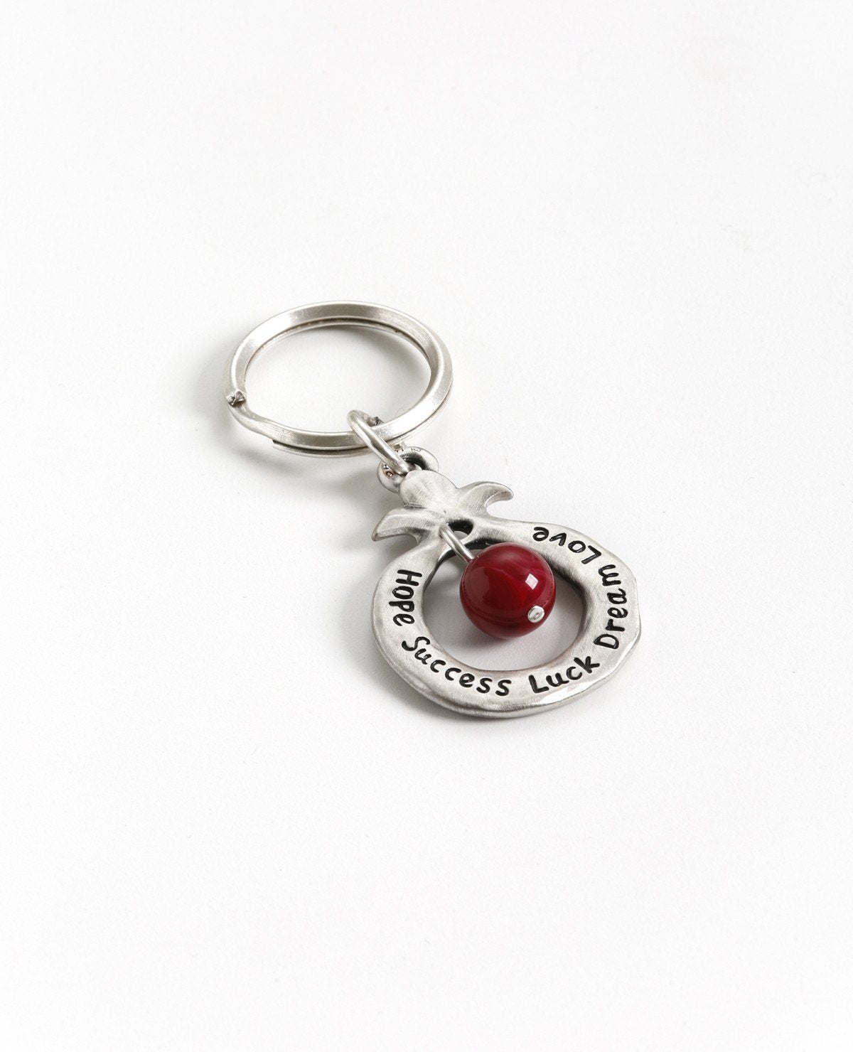 Always bless!
A charming keychain, designed as a hollow pomegranate with a big red bead in the center.
Written on one side are many blessings in Hebrew, and on the other side many blessings in English. The keychain is coated in sterling silver and is strong and reliable.
Makes for quite the useful gift that is also festive and very blessed, suitable for both Hebrew and English speakers, near or far, in Israel and abroad.
Comes also in your choice of turquiose colored bead. Length: 8 cm Width: 4 cm