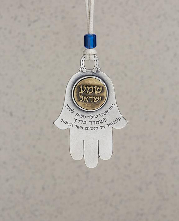 Sterling silver and brass plated car pendant with a blue bead. Length: 8 cm Width: 5 cm