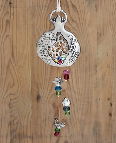 A uniquely designed pomegranate shaped hanging ornament. It is coated in sterling silver and embedded with colorful Swarovski crystals and decorated also by beaded leather straps featuring special motifs that symbolize luck and good fortune. The hanging pomegranate makes for a touching and original gift that will suit any home and especially bring joy to those which you love. Comes also in your choice of turquoise embedded stones.  Length: 10 cm  Width: 7 cm