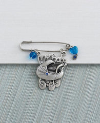 Baby carriage pin, embedded with Swarovky crystal.  Length: 7 cm  Width: 7 cm