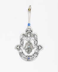 A hanging Hamsa ornament with a delicate filigree like design and a small Hamsa hanging from its center with the words "Drop of Luck". The Hamsa is decorated at its edges with pairs of motifs from the world of good luck charms and blessings, among them a pomegranate, a flower, a fish and a key. All these face each other to multiply the strength of the blessing. The ornament is coated in sterling silver and embedded with blue colored Swarovski crystals. Comes with a natural colored faux leather string, decor