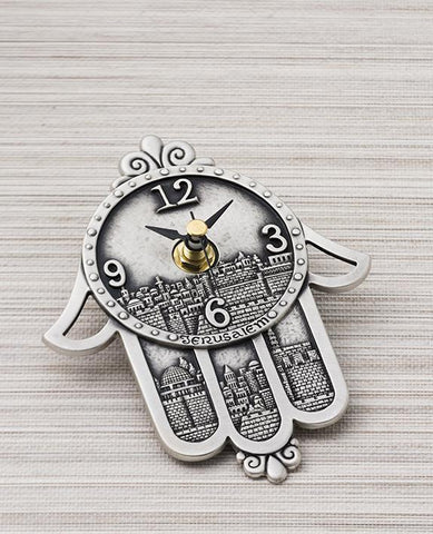Sterling silver plated clock in the shape of hamsa.  Length: 15 cm  Width: 11 cm