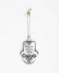 Uniquely designed sterling silver coated Hamsa Home Blessing hanging ornament. The Hamsa is decorated with embossed geometrical shapes, symbolizing abundance, fertility, success and protection from the "evil eye". The ornament makes a wonderful gift for any home, one that displays attentiveness, invoking good luck and blessings to anyone who shall receive it. Comes with a faux leather string for hanging decorated with a turquoise bead. Additional languages available: Hebrew and Russian.  Length: 9 cm  Width
