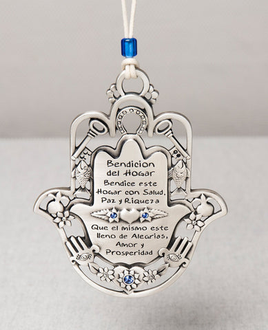 An impressive and exceptional hanging Home Blessing. Shaped like a Hamsa and decorated by motifs such as a key, a fish, a horseshoe and a pomegranate, which according to Judaism symbolize respectively: a new way, fertility, luck and abundance. The ornament is coated in sterling silver, embedded with blue Swarovski crystals, and comes with a faux leather string for hanging, decorated with a blue bead. A fantastic gift to grant any new home, great for new beginnings, or for anyone you wish to greet with love,