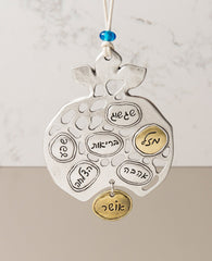 A pomegranate hanging ornament with blessings, exquisite in its beauty! Its design combines empty spaces with full ones, brass and silver, alongside words of inspiration and blessing. The pomegranate is designed as hollow shapes with sterling silver and brass coated plates in between. Each plate has a blessing written on it: prosperity, luck, health, abundance, success, love and happiness. This gift is perfect for those with a taste for the finer things. Those who can appreciate the intention of the blessin