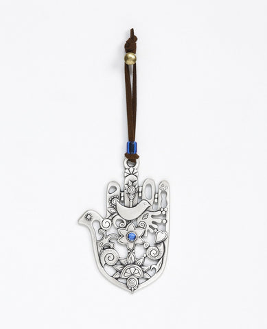 A subtle, authentic and artistically designed Hamsa hanging ornament. The Hamsa is coated in sterling silver and is designed as spaces and embossments of blessing motifs. At the center of the Hamsa is a flower inlaid with a blue Swarovski stone and above it an embossed dove. The thumb of the Hamsa is designed as the head of a dove and the ornament in its entirety resembles the shape of both a Hamsa and a dove. This is a charming and blessed hanging ornament that combines the qualities of the Hamsa for luck 