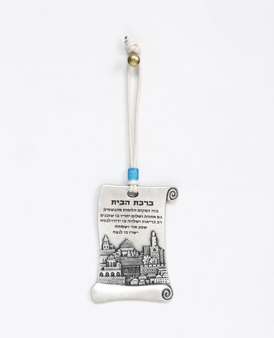 A hanging Home Blessing ornament in the shape of a scroll, coated in sterling silver and decorated with a beautiful embossed image of the city of Jerusalem. The scroll shaped design connects us back to ancient times, which already then the power of words were acknowledged as a force that can manifest abundance and joy in our life. The hanging ornament comes with a faux leather string decorated with a blue colored bead.   Length: 9 cm  Width: 5 cm