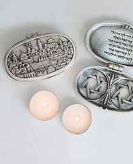 Sterling silver plated candlesticks with Jerusalem embeded on them.   Length: 9 cm  Width: 6 cm
