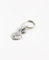 A small fish keychain with the words "easy for you!". The word 'easy' is coated in sterling silver and embedded with a blue colored Swarovski crystal. The design is sweet and elegant, plus it's fun to pull out of your pocket with all your keys safely attached. Together with a loving smile, it makes a great gift to give to those that matter to us, in order to remind them how talented and capable they are in accomplishing anything they may choose. The luck is already inside.   Length: 5 cm  Width: 2 cm