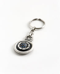 "There is no place too far"! That is the inspiring message of this charming keychain. An exciting and unique design on this round keychain. One side is engraved with the image of The Little Prince surrounded by stars, and on the other side is a compass. 
The keychain is coated in sterling silver and hangs from a strong and reliable linked chain. 
A special and marvelous gift to grant to anyone you hold dear, in order to bless them at every moment with full confidence in themselves, and a compass to show the
