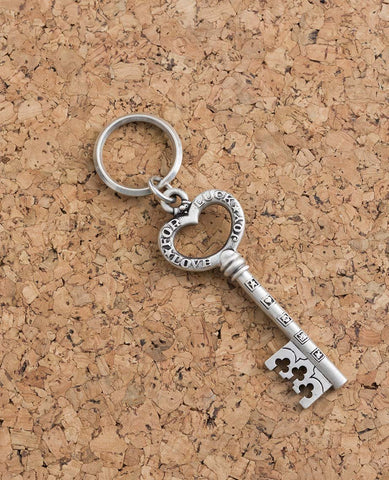 A pretty and impressively designed keychain in the shape of a key with a heart. On one side it is delicately decorated in black, and on the other side appear the words: For Luck, Love, Joy.
A special and joyful gift that's always good to have in your pocket. For English speakers in Israel and abroad, a useful reminder of our loved ones and the blessings we hold for them in our heart. 
The keychain is coated in sterling silver, strong, reliable and oh so pretty!  Length: 9 cm  Width: 3 cm