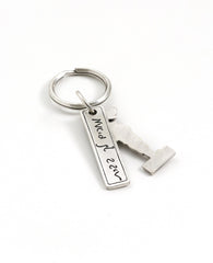 Who doesn't have a soldier waiting for them at home? A quality keychain with a personal tone and a touch of longing. The keychain is coated in sterling silver and made up from two parts: one designed like a caricature of a soldier with the word "Attention!" at his feet. The second part is in the shape of a long rectangular plate engraved with the numbers "1 2 3", and on the other side the words "waiting for you at home". The keychain is strong and reliable. Most suitable as a gift for your soldier, who will
