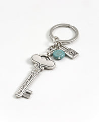 This keychain opens the door to success! A double sided key, which on one side has the words "your key to success" inscribed, and the other side is decorated with rich motifs and noble embossments. The tip of the key is attached to a linked chain which has a small lock and a beautiful turquoise stone hanging from it. The keychain is coated in sterling silver and is strong and reliable. A gift for those with a taste for the finer things, which you wish to remind that any lock in their life can be opened by t