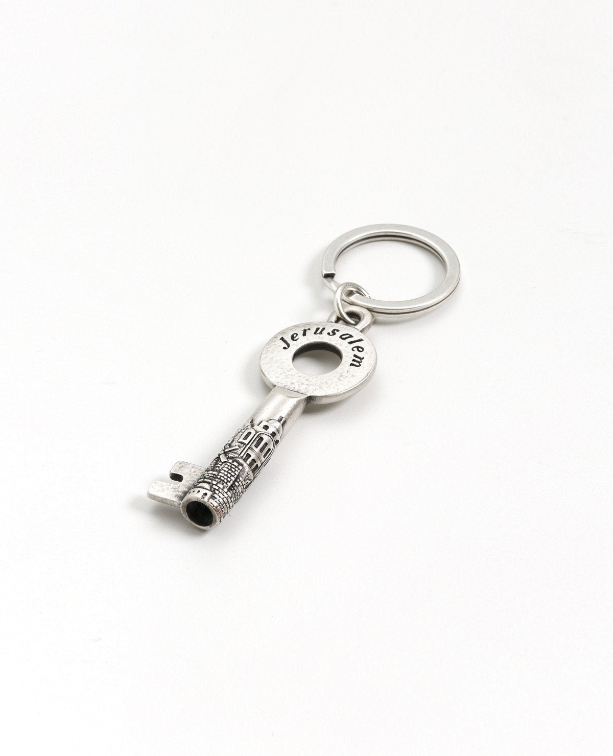 An artistic and uniquely designed sterling silver coated keychain. Engraved on the keys handle is the word "Jerusalem", and along its side an embossed image of the Jerusalem landscape. The keychain is strong and reliable and will make a charming gift and serve as a daily reminder for Jerusalem lovers, in Israel and abroad.   Length: 8 cm  Width: 3 cm