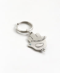 An extraordinarily beautiful keychain with a rare design, coated in sterling silver. On one side of the Hamsa is a dove inlaid with a turquoise colored Swarovski crystal. Engraved on top is the Kohen's blessing "May the Lord bless you and keep you safe". On the other side of the Hamsa are two doves looking in opposite directions, with a heart in between them that is also embedded with a turquoise stone. A keychain that is all beauty and blessings. The Hamsa's blessing for good luck, the doves blessing for p