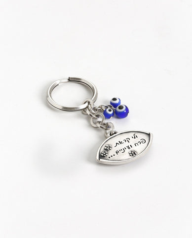 "Flower" and "eyes" are loving nicknames in Hebrew. Now it will be with you all the time and open doors in your life. A sweet and charming keychain coated in sterling silver and decorated with an abundance of blue eyes for protection from any "evil eye". On one side of the keychain is an embossed image of an eye embedded with a blue eye, and engraved on the other side is the sentence "...and you called me flower and eyes..." decorated with cute little flowers. Three more blue eyes hang from a chain that is 