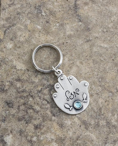 Sterling silver plated key ring with a Swarovsky crystal.  Length: 8 cm  Width: 4 cm