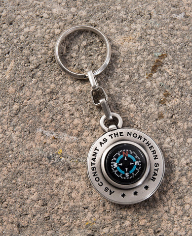 An intriguingly designed and one of a kind keychain. One side is a (real) compass encircled by the words "As constant as the northern star". On the other side is an ancient drawing of the map of the world. The keychain is coated in sterling silver and is strong and reliable. A charming and useful gift that will always remind its owner that North is always there and all you have to do is find it. Compass is already inside.    Length: 9 cm  Width: 4 cm