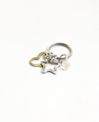 An original and special keychain, designed as a ring upon which hang a heart, a star and a crystal-like bead. The keychain is coated in sterling silver except for the star which is coated in brass, making for a magnificent color combination. Makes a fun gift, for her or him, for any occasion you wish to bring joy with a special present.  Length: 6 cm  Width: 3 cm