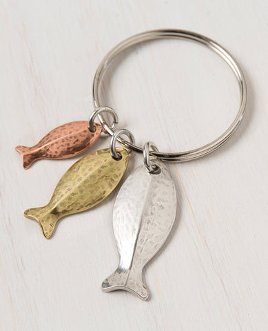 A stunning keychain that comes with a smile and a triple blessing. Designed in the shape of a ring upon which hang three cute fish in different sizes, coated in three different metals and colors: silver, gold and copper. The fish symbolizes fertility, abundance and luck (in Hebrew fish spelled backwards is luck). A fun gift full of beauty, motion and lots of good luck! Grant it with love to anyone important which you hold dear, and to anyone who you always wish luck, abundance and blessing. The keychain is 