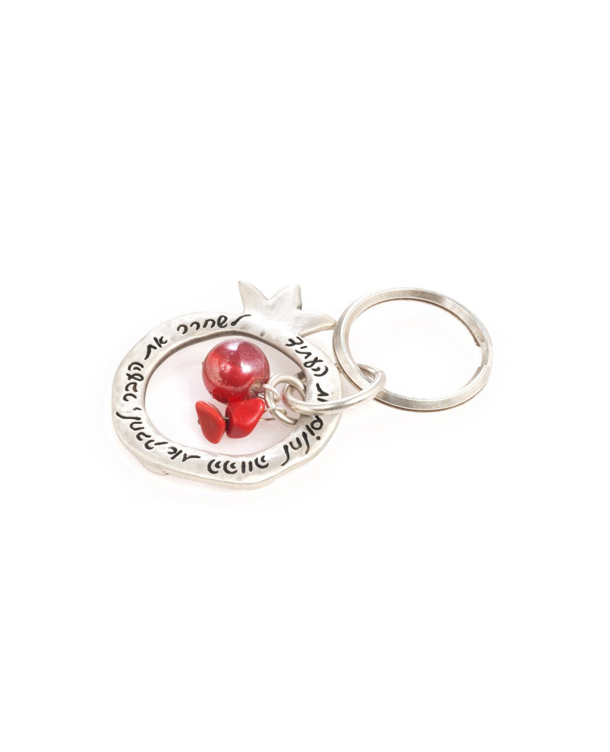 A charming keychain with an important message for life. The keychain is designed as a hollow pomegranate coated in sterling silver. At its center hang a red bead and two beautiful red stones. Written on one side of the pomegranate frame are the words "Let go of the past, embrace the present, dream the future". On the other side of the frame are little pomegranate decorations. The keychain is strong and reliable. A wonderful and exciting gift for him or for her, or for anyone in fact who wants to live life a