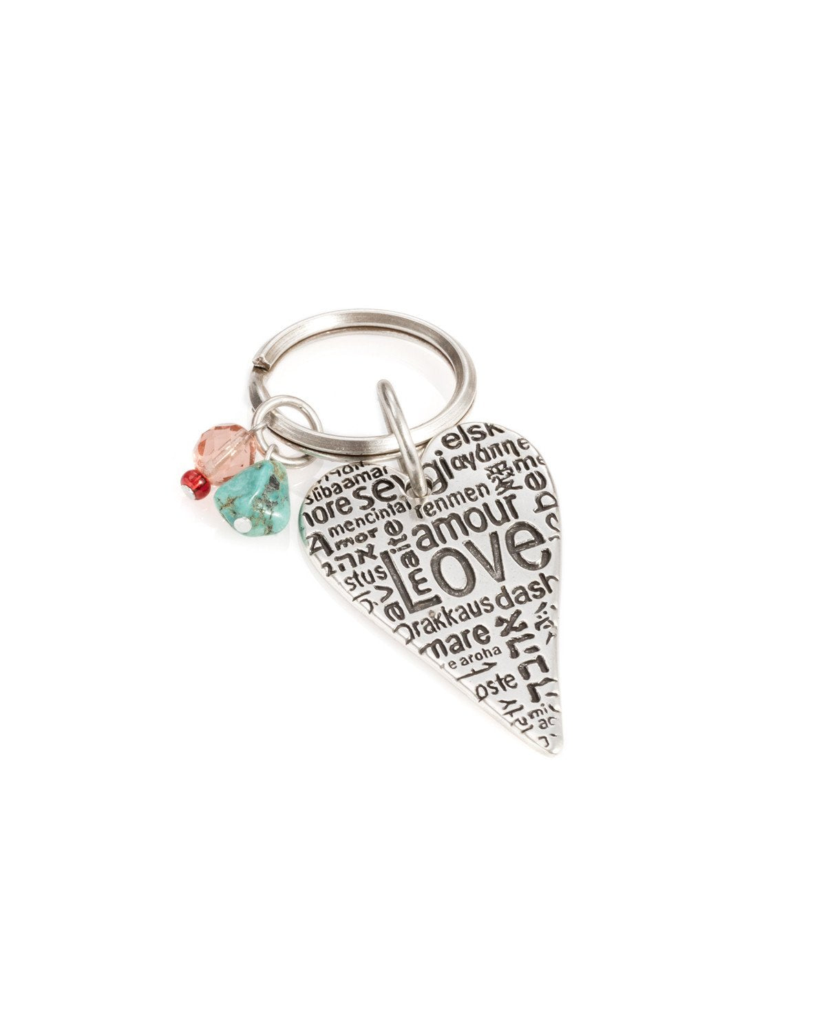 A one of a kind keychain that crosses borders and brings hearts together. Designed as an elongated heart coated in sterling silver, upon which the word "Love" is written in different languages. Hanging on the keyring next to the heart are two colorful beads that add beauty and intrigue. The keychain is strong and reliable. Makes a great gift of love, anywhere and at any time, so that in the moment of truth, you won't find yourself at a loss for words...  Length: 9 cm  Width: 3 cm