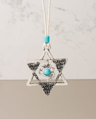 Sterling silver plated car pendant with a turquoise bead.  Length: 8 cm  Width: 7 cm