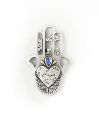 Hamsa shaped magnet with Swarovsky crystal and the 7 blessings.  Length: 7 cm  Width: 5 cm