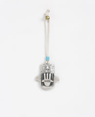 Sterling silver plated car pendant with a turquoise bead.  Length: 7 cm  Width: 6 cm