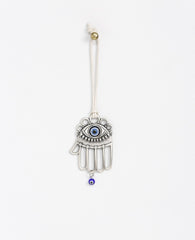 Sterling silver plated car pendant with a blue bead.  Length: 8 cm  Width: 5 cm