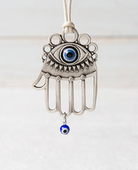Sterling silver plated car pendant with a blue bead.  Length: 8 cm  Width: 5 cm