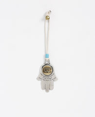Sterling silver and brass plated car pendant with a turquoise bead.  Length: 8 cm  Width: 5 cm