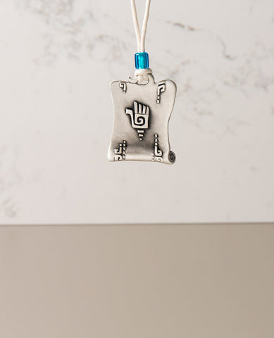 Sterling silver plated car pendant with a blue bead.  Length: 5 cm  Width: 4 cm