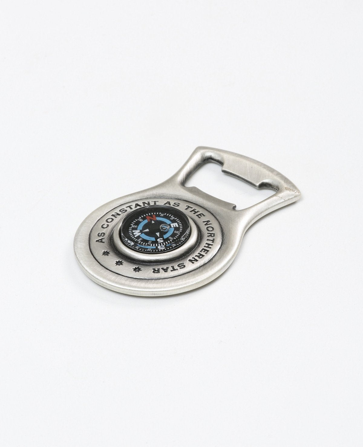 A sterling silver beer opener with a compass.  Length: 7 cm  Width: 5 cm